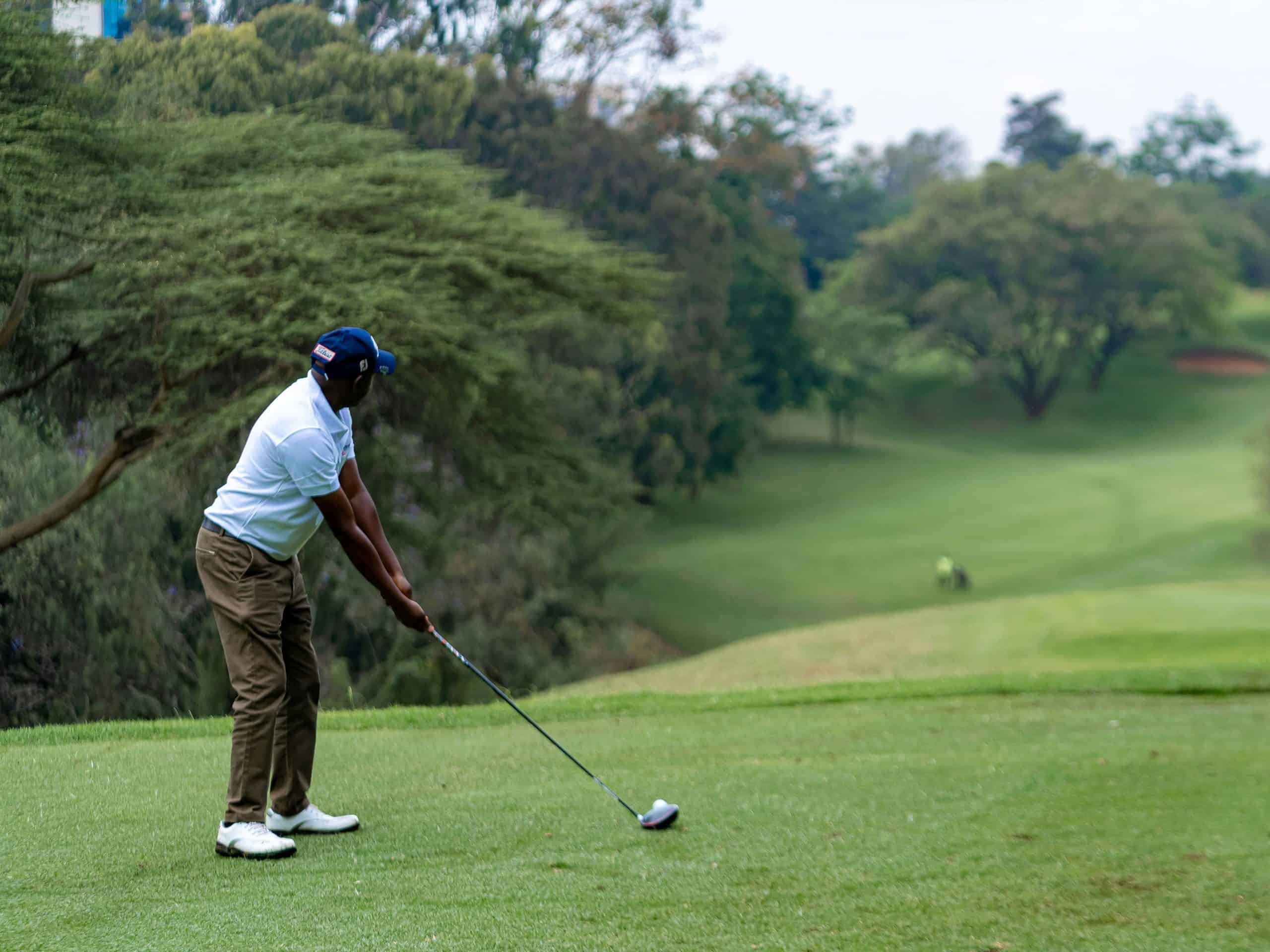 Guest playing golf on a lush course during a Kawaiki golf tour in Sri Lanka