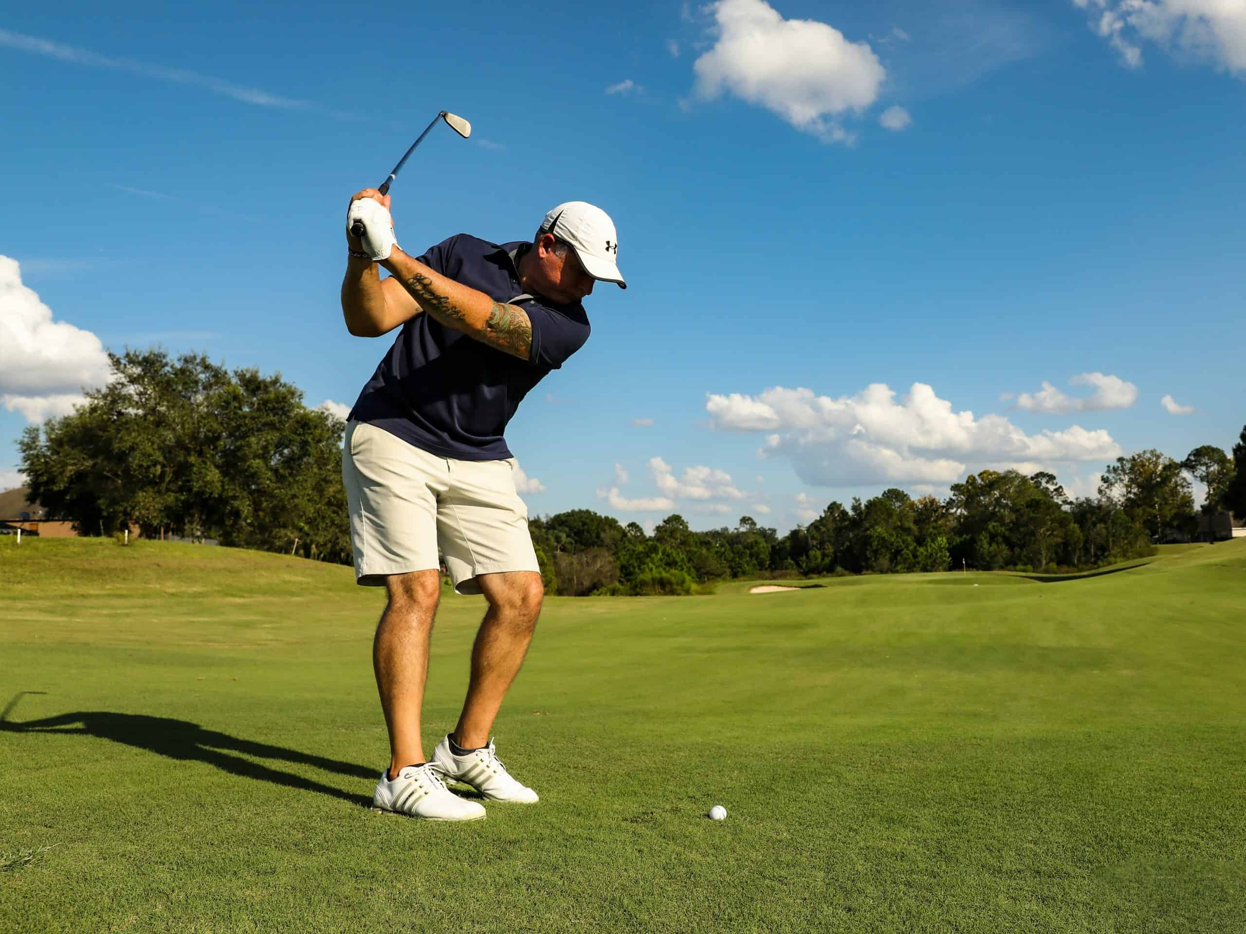 Guest playing golf on a lush green golf course during a Kawaiki Tours & Travels golf tour in Sri Lanka